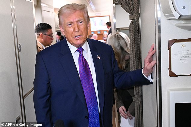 President Donald Trump speaks to reporters on Air Force One