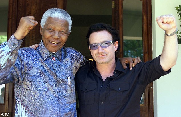 Irish rock star Bono, right, and former South African President Nelson Mandela pose together in 2002