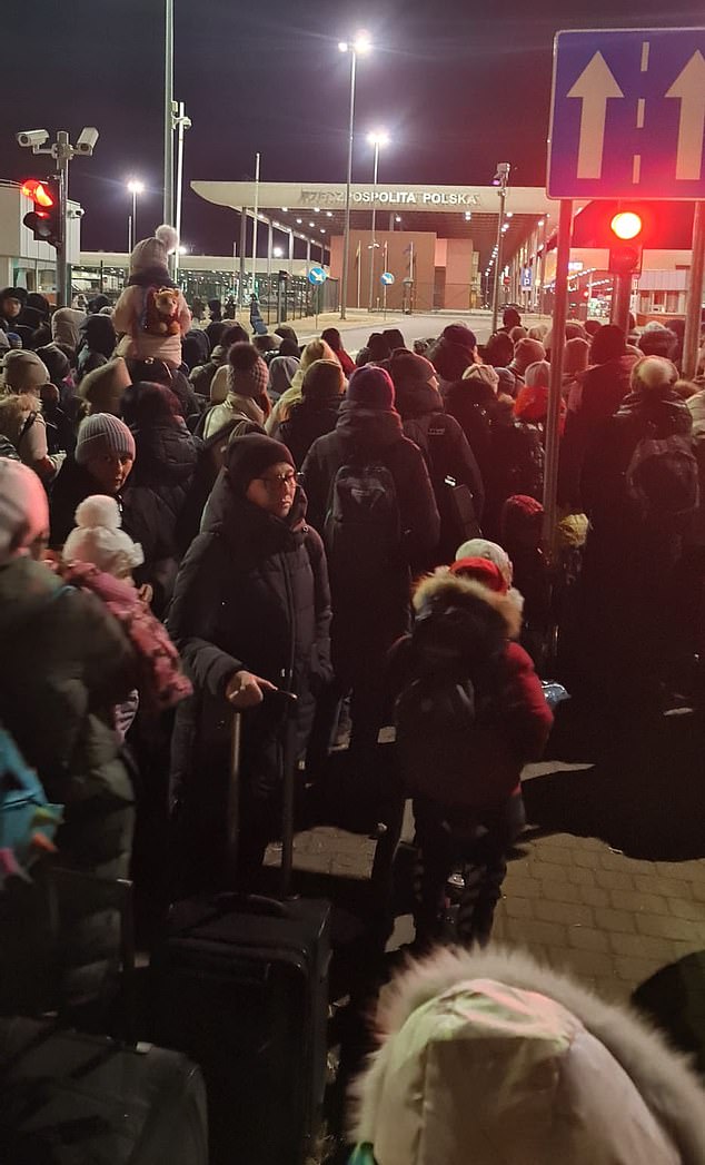 Mrs Ponomarova at the Polish border with fellow refugees in 2022. She said the journey was 'like an adventure' for her two children but she described the situation as 'surreal'