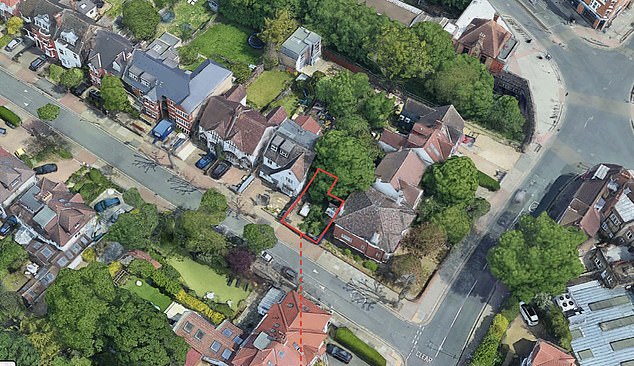 Pictured: The narrow patch of land - wedged between existing homes - where the property is being built