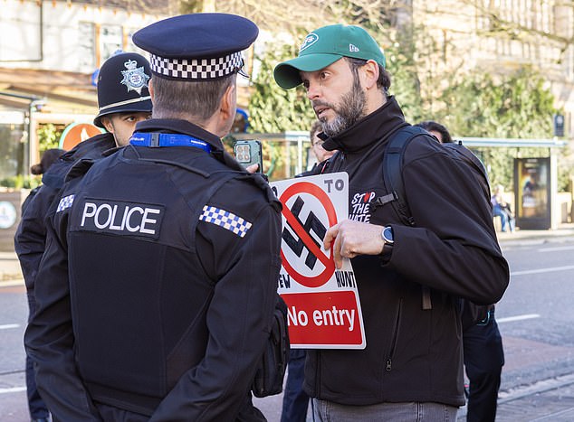 Tables turned on the Pro-Palestine 'Jew hunters': Activists planning to go door-to-door asking locals to boycott Israeli products are foiled by counter-protesters making them hide in pub