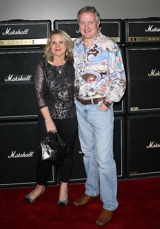 Wife of ex-boss of music giant Marshall Amps died from cancer caused by inhaling asbestos fibres when hugging her factory worker father after work, inquest hears