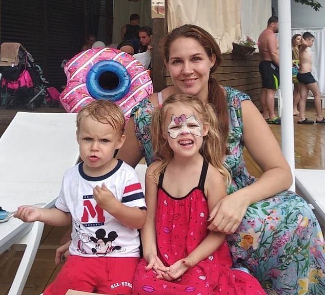 Iryna Rizak with her two children: Kateryna (right) and Boris (left) in Ukraine before the war. Before Russian invaded Ukraine, Mrs Rizak worked for the Ukrainian Parliament in Kyiv