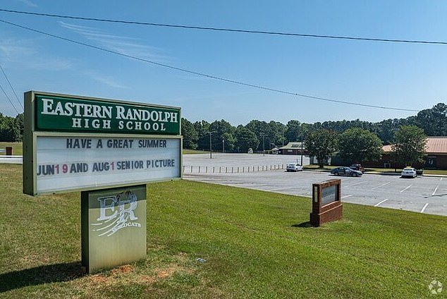 Eastern Randolph School Corporation said Hughes 'has been removed from all duties with students pending the outcome of the legal process'