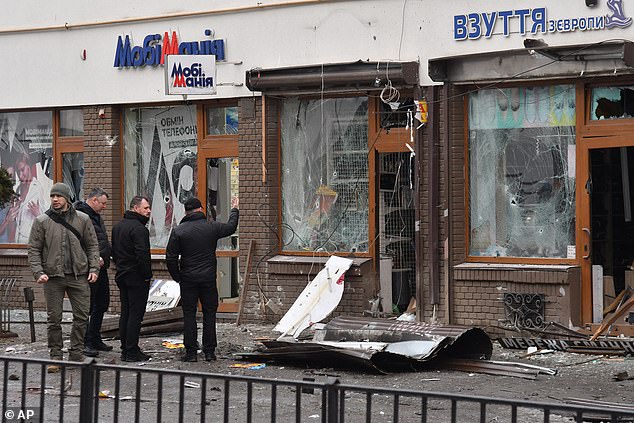 The aftermath of a bombing on police in Lviv in which a policewoman was killed and dozens were wounded