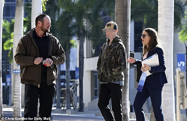 Exclusive Daily Mail images show him arriving at Miami’s James Lawrence King Federal Justice Centre flanked by his father, Thomas Hudson, who is now seeking custody of the boy