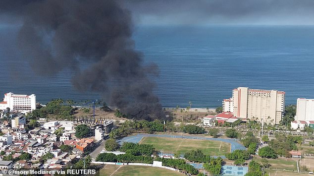 Smoke billows around the tourist area of Puerto Vallarta amid a wave of violence, with torched vehicles and gunmen blocking highways in more than half a dozen states