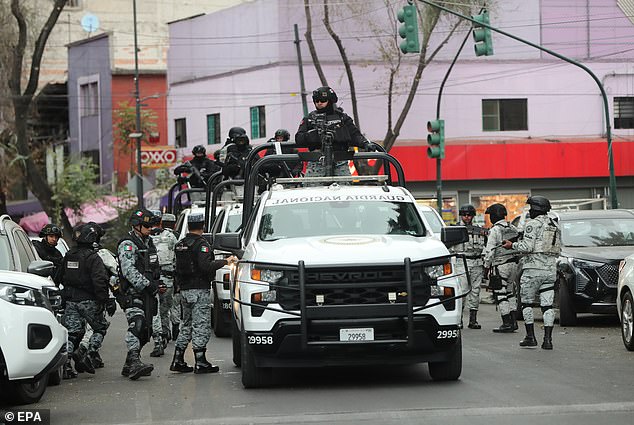 A National Guard convoy in Mexico City, Mexico, on February 22, escorts a Rhino, an armored tactical vehicle used for high-impact operations and critical security situations, after federal forces kill Nemesio Oseguera Cervantes