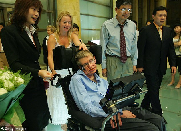 Hawking lived for more than 50 years with motor neuron disease (ALS) and required round-the-clock care from a team of nurses. He is seen with one his nurses at a hotel in Beijing, China on June 17, 2006. It is unclear if this woman is the same person who appeared alongside him in the Epstein files