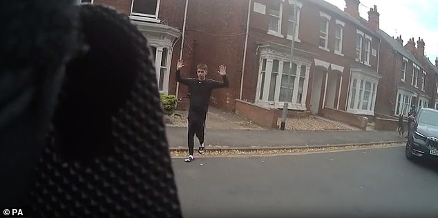Police bodycam footage shows the killer putting his arms up in surrender