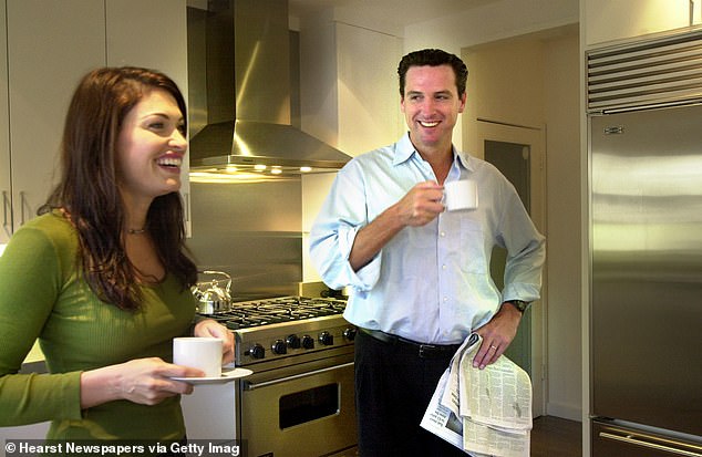 Kimberly Guilfoyle (left) and Gavin Newsom (right) were photographed in their San Francisco home in an undated photo by the San Francisco Chronicle. Newsom served as San Francisco mayor before becoming California's lieutenant governor and then governor