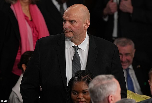Senator John Fetterman arrives before President Donald Trump delivers the State of the Union address to a joint session of Congress in the House chamber at the U.S. Capitol in Washington, Tuesday - a rare occasion in which the lawmaker has worn a suit and tie