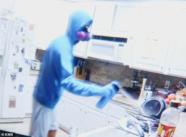 The suspect, who has not been named, was seen spraying his roommate's groceries in shocking footage caught by a camera in the shared home in Santa Clarita, California