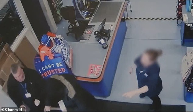 A staff member (right) points where Mikulski went, as security guard Jeff (left) goes after him