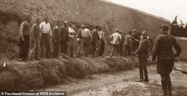 One haunting image that's been put up for sale shows the Greek men being lined up at a firing range