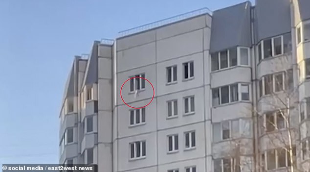 Hair-raising moment toddler plunges 10ft from tower block window - before hero nurses use a COAT to catch him