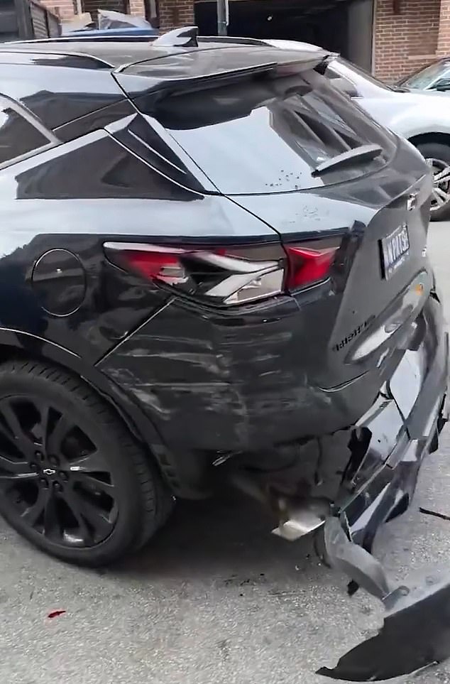 Officers went all out to arrest Brockman, even smashing a driver's SUV when it refused to get out of the way (pictured)