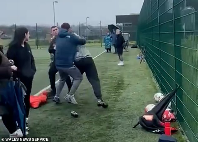 Terrified onlookers shouted at the angry men 'You've got your boys watching' to try to stop the madness