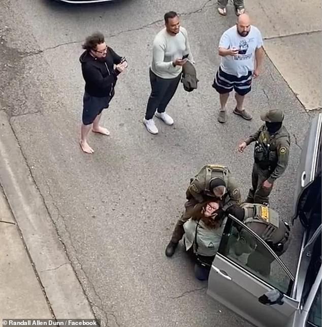 Brockman was seen in a viral video on the ground and handcuffed by mask-wearing CBP officers in the Lincoln Square neighborhood in October (pictured)