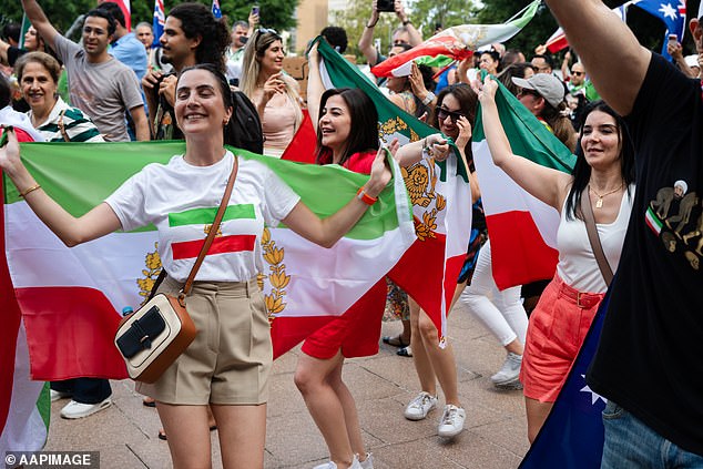 A second demonstration in Hyde park (above) celebrating the military strikes was attended by an estimated 20,000 people