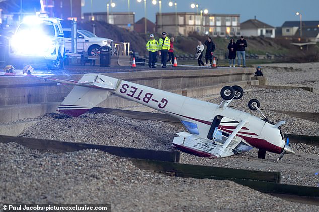 Plane crashes into popular UK beach as pilot forced to 'crawl from the wreckage into water'