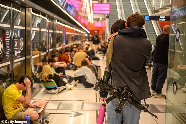 Israelis taking shelter at an underground train station as they prepare for retaliatory missile strikes