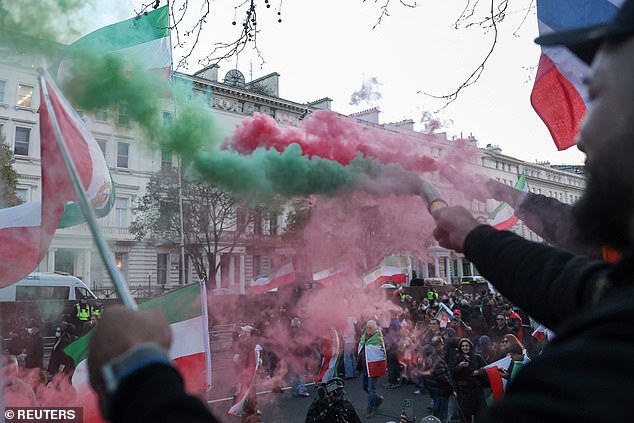 It came a few hours after hundreds of Iranian democracy activists gathered in Whitehall for a separate protest (pictured) calling for the end of the Iranian government