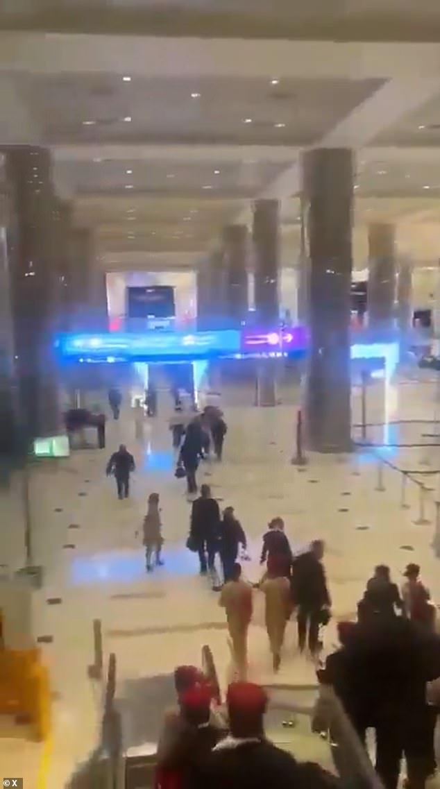 Panic at Dubai Airport as 'it is hit by an Iranian suicide drone' and passengers flee wrecked terminal