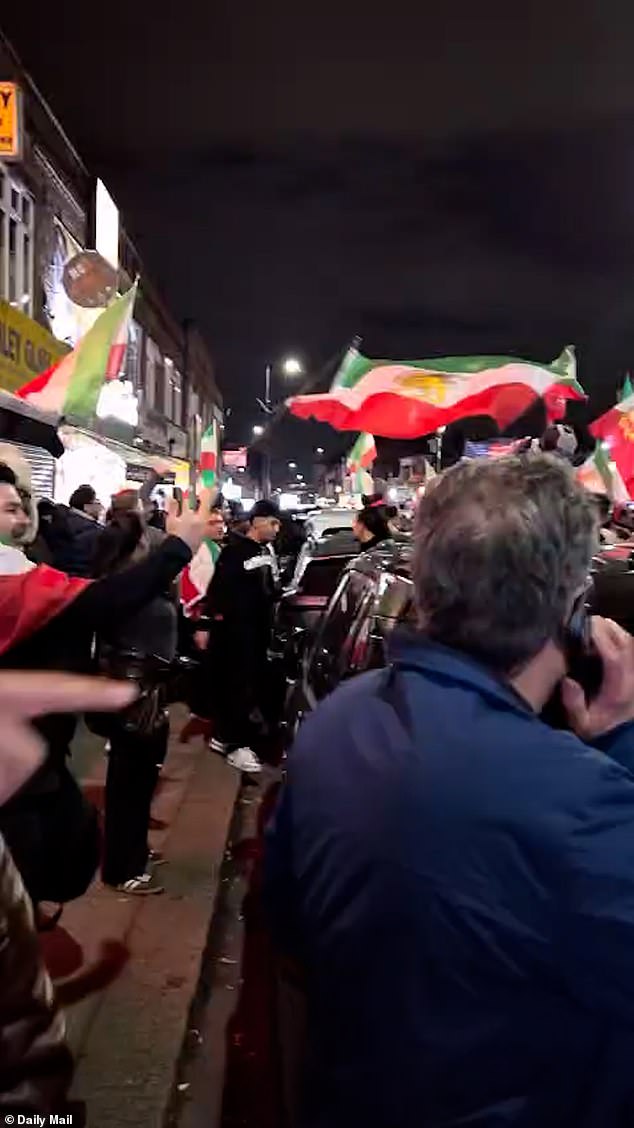Members of the Persian community in Ballard Lane, North Finchley, waved the Iranian flag of the pre-Islamic regime, while others waved the US flag