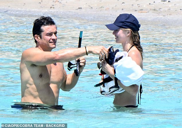 Katy Perry and Orlando Bloom's ditch joint 'blended family' breaks as pair take separate child-free holidays with their new partners Justin Trudeau and Luisa Laemmel