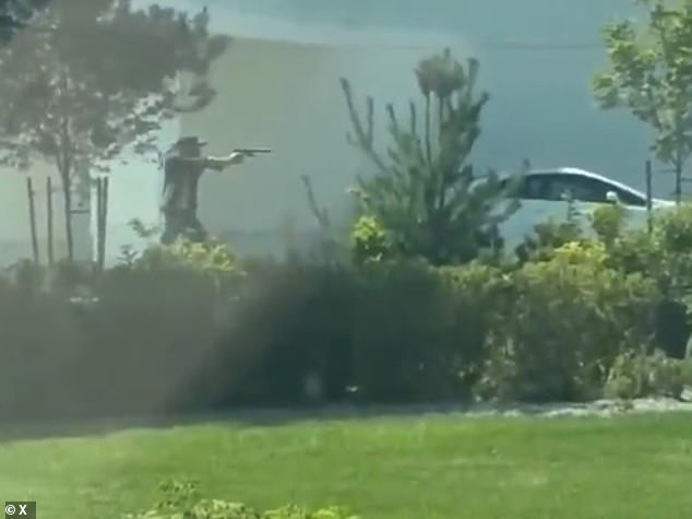 A second man was seen firing back at the gunman with a handgun, with a witness praising the anonymous hero for confronting the suspect before helping victims get to safety