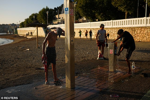 Migrants had no access to any facilities so were forced to shower on the beach after crossing