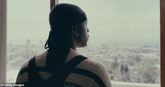 Students at the historically black school will not be allowed to wear du-rags or bonnets (Stock photo of an unrelated young man in a du-rag looking out a window)