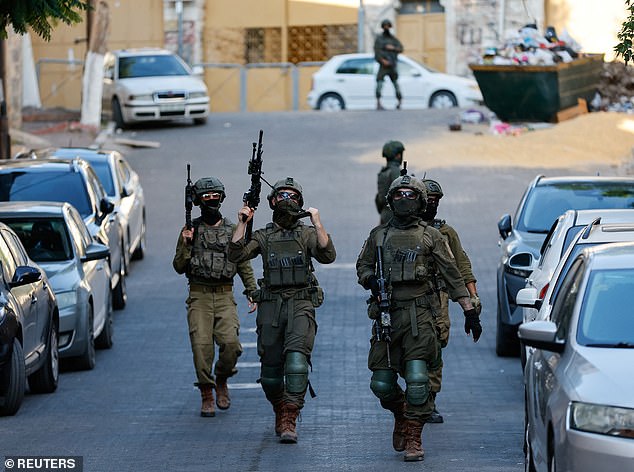 A joint operation would see Israel return to the battlefield after pausing its attacks under the US-brokered truce. Israeli soldiers are seen here in the Israeli-occupied West Bank