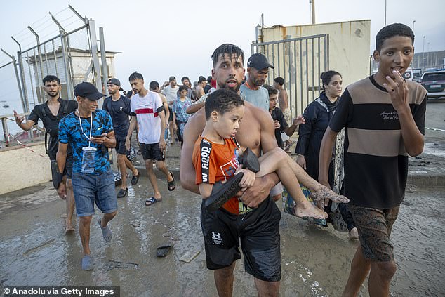 About 60,000 migrants were able to bypass a long border fence between Morocco and the Spanish territory of Ceuta on Thursday