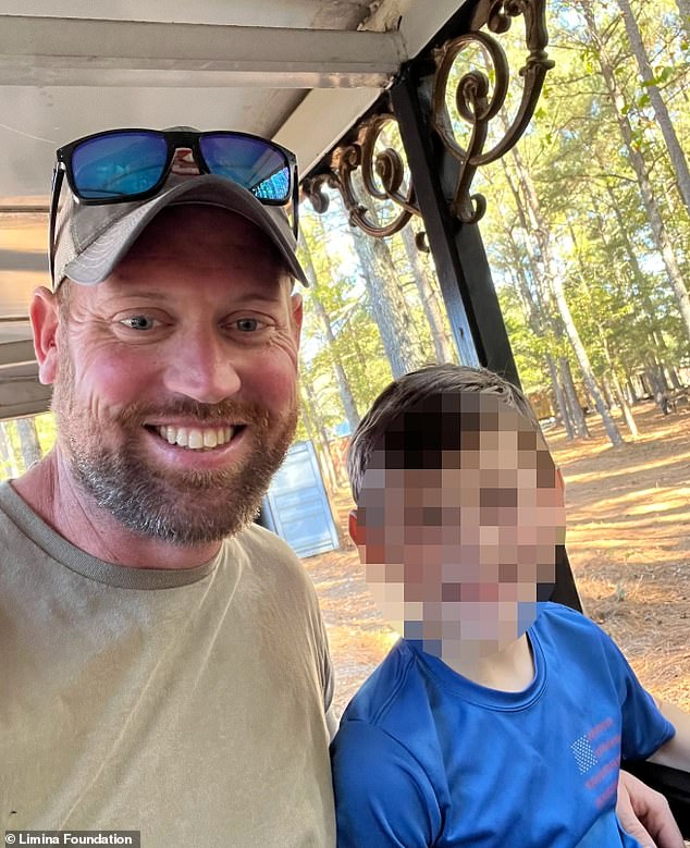 Matthew Ammel in a family photo with what appears to be his young son