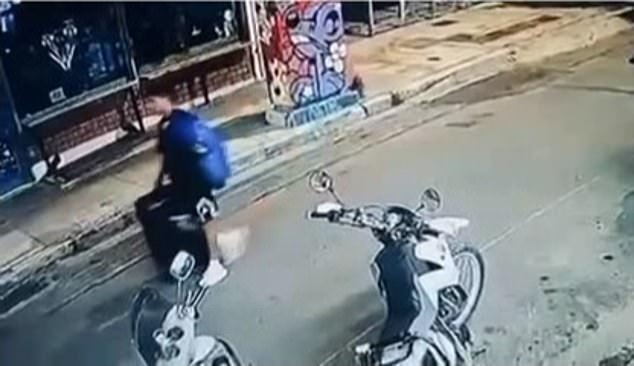 This is the moment the Afghan professional boxer walks through the streets of Athens carrying a suitcase allegedly containing the body of Briton Elisabeth-Jane Ross