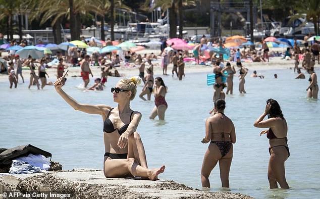 The Med is too hot for swimmers! Tourists say they can't cool down as water temperatures hit exceptionally high levels