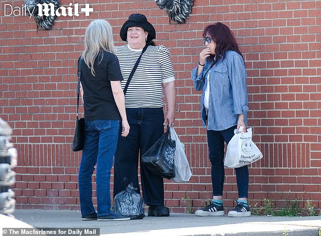 Meg and her two friends shared a cigarette and a chat following their lunch at a spot in Dearborn