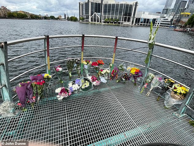 Floral tributes have been laid at Millwall Outer Dock, on the Isle of Dogs, following Banta's death