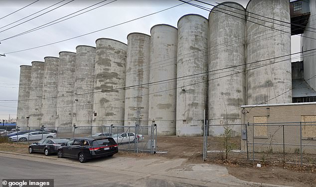 The 18-year-old landed on a beam outside of the grain elevator after plunging, the Minneapolis Police Department said