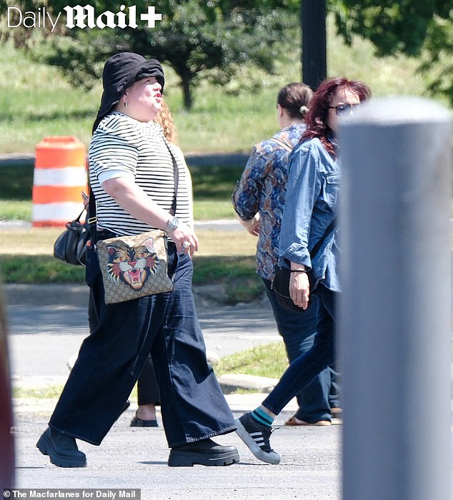 Meg dressed casually for her outing in Detroit - but the $1,500 Gucci x Supreme bag she toted offered a subtle hint to her success and wealth