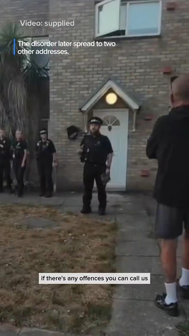 A police officer addressed the mob at one address, warning them they had the right to 'freedom of expression' but they had to do it 'peacefully'