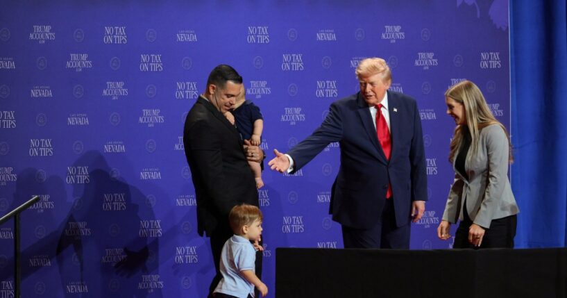 President Donald Trump introduces a family who has benefitted from the "no tax on tips" policy onstage during an event at Red Rock Casino Resort and Spa on Aug. 5, 2026, in Las Vegas, Nevada.