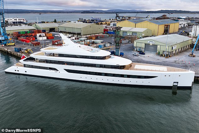 This superyacht makes a splash! £220m mega-vessel with giant swimming pool on board for its 'keen swimmer' owner moors up off South Coast
