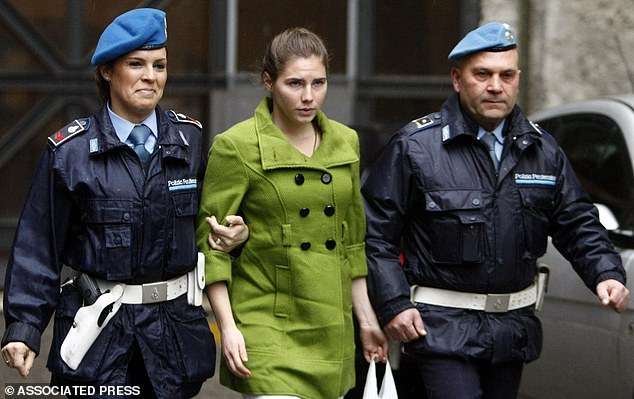 Knox is escorted out court in December 2009. In the years since her wrongful conviction, Knox has written two memoirs and hosted two podcasts