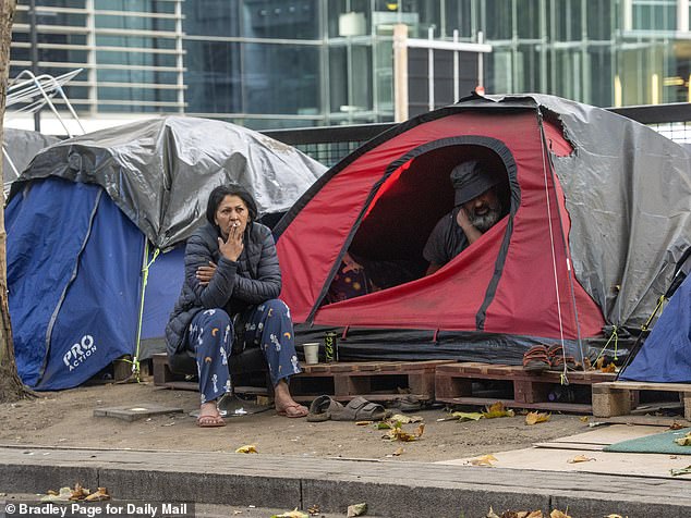 Wastewater was flung onto the road as they puffed on cigarettes and mingled over breakfast before heading out into London