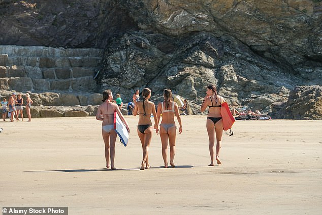 Women enjoyed the weather in Polzeath in Cornwall, nicknamed the 'poshest' seaside town
