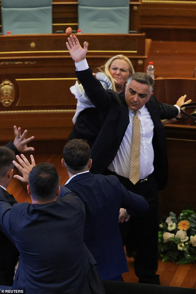 Multiple MPs and security guards intervened but Ms Kadrijaj continued chucking the eggs, which she had hidden in her handbag