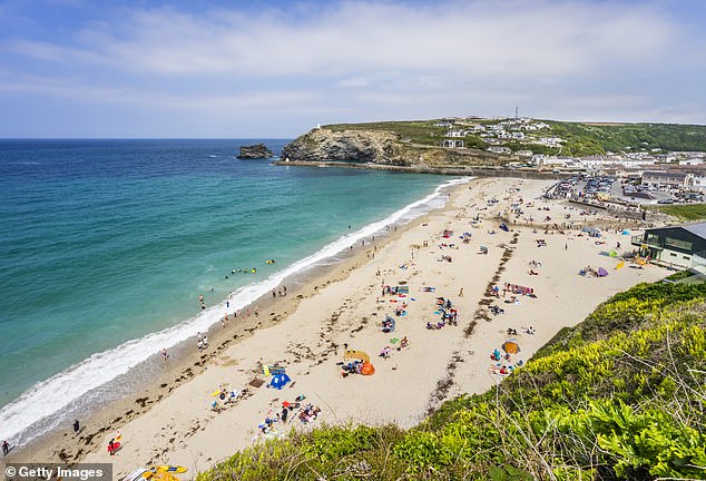 The UK faces its fifth heatwave this year, with highs of 36C expected next week, which will prompt people to flop on the nation's beaches (Pictured: Portreath in Cornwall)